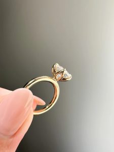 close-up shot of diamond engagement ring with petal setting