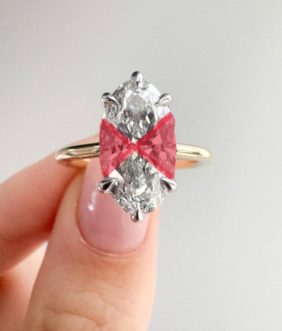 A marquise cut diamond with the bow tie area highlighted in red